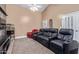 Cozy living room area with theater seating, popcorn machine, and neutral colors at 3203 E Ellis St, Mesa, AZ 85213