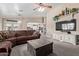 Open-concept living room with a large sofa and seamless flow to the kitchen area at 3203 E Ellis St, Mesa, AZ 85213