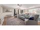 Spacious living room with a ceiling fan, large area rug, and an open floor plan at 3203 E Ellis St, Mesa, AZ 85213