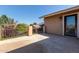 View of a patio with iron railing, showcasing the home's exterior and a glimpse of the neighborhood at 3203 E Ellis St, Mesa, AZ 85213