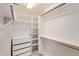 Walk-in closet features built-in shelving and hanging rods at 3203 E Ellis St, Mesa, AZ 85213