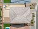 Aerial shot of the backyard, showcasing hot tub, desert landscaping and roof at 3366 E Constance Way, Phoenix, AZ 85042