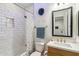 Updated bathroom with subway tile shower, modern vanity and stylish decorative touches at 3366 E Constance Way, Phoenix, AZ 85042