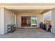 Relaxing covered patio boasts brick flooring, a grill, and outdoor seating, perfect for entertaining at 3366 E Constance Way, Phoenix, AZ 85042