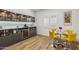 Modern dining area with a bar, wine fridge, and stylish decor, perfect for entertaining at 3366 E Constance Way, Phoenix, AZ 85042