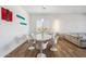 Bright dining room with a sleek, modern table, designer chairs, and stylish lighting at 3366 E Constance Way, Phoenix, AZ 85042