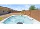 Hot tub situated in backyard area with brick privacy walls and desert landscaping at 3366 E Constance Way, Phoenix, AZ 85042
