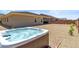 Hot tub with wooden exterior and desert landscaping for backyard enjoyment at 3366 E Constance Way, Phoenix, AZ 85042