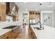 Spacious kitchen with stainless steel appliances, expansive island, and natural wood cabinetry at 3366 E Constance Way, Phoenix, AZ 85042