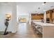 Modern kitchen with a spacious island, stainless steel appliances, and light-toned cabinets with wood tile flooring at 3366 E Constance Way, Phoenix, AZ 85042