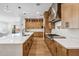 A gourmet kitchen with a large center island, modern appliances, and ample cabinet space at 3366 E Constance Way, Phoenix, AZ 85042
