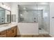 Modern main bathroom featuring a single sink vanity and an enclosed glass shower with unique tiling at 3366 E Constance Way, Phoenix, AZ 85042