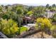 Aerial view of a private backyard with a pool, outdoor bar, mature trees, and lush landscaping at 3522 E Cherokee St, Phoenix, AZ 85044