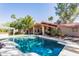 Private backyard retreat with a sparkling pool, covered patio, and lush desert landscaping at 3522 E Cherokee St, Phoenix, AZ 85044