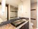 Updated bathroom featuring a vessel sink, granite countertops, and tiled shower at 3522 E Cherokee St, Phoenix, AZ 85044