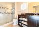 Modern bathroom with a glass enclosed shower, decorative tile, and updated vanity at 3522 E Cherokee St, Phoenix, AZ 85044