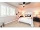 Bedroom with shuttered windows, stylish lamps, and a ceiling fan at 3522 E Cherokee St, Phoenix, AZ 85044