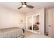 Inviting bedroom with twin beds, ceiling fan, and mirrored closet doors at 3522 E Cherokee St, Phoenix, AZ 85044