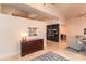 Elegant foyer with marble floors, a dark wood bookcase, and neutral-toned furniture at 3522 E Cherokee St, Phoenix, AZ 85044