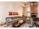 Inviting living room featuring a brick fireplace, comfortable seating, and stylish accents for a cozy atmosphere at 3522 E Cherokee St, Phoenix, AZ 85044