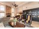 Open living room with fireplace, bookshelf, and comfortable seating, connecting seamlessly to other areas at 3522 E Cherokee St, Phoenix, AZ 85044