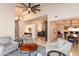 Open concept living room with vaulted ceiling, neutral decor, and views into other living spaces at 3522 E Cherokee St, Phoenix, AZ 85044