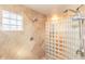 The shower features a glass block wall and tile surround at 3522 E Cherokee St, Phoenix, AZ 85044