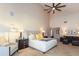 A bright main bedroom featuring a ceiling fan, a seating area, and an ensuite living area at 3522 E Cherokee St, Phoenix, AZ 85044