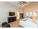 Spacious main bedroom with a vaulted ceiling, stone fireplace, and french doors to the outside at 3522 E Cherokee St, Phoenix, AZ 85044