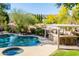 Beautiful pool area with built in barbeque, hot tub and mature landscaping at 3522 E Cherokee St, Phoenix, AZ 85044