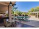 Inviting outdoor pool area with patio furniture, landscaping, and a built in barbeque at 3522 E Cherokee St, Phoenix, AZ 85044