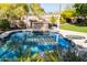 Backyard pool with a diving board, outdoor bar, desert landscaping, and plenty of room for seating at 3522 E Cherokee St, Phoenix, AZ 85044