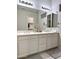 Bathroom with double vanity, bright lighting, and mirrors, creating a clean and modern aesthetic at 3780 E Rakestraw Ln, Gilbert, AZ 85298