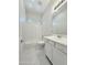 Pristine bathroom featuring a tub-shower combo, white vanity, sleek fixtures, and tiled floors for a fresh, clean feel at 3780 E Rakestraw Ln, Gilbert, AZ 85298