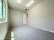 This bonus room includes neutral walls, soft gray carpet, a bright window and recessed ceiling lights at 3780 E Rakestraw Ln, Gilbert, AZ 85298
