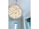 A uniquely styled chandelier hangs from the ceiling, providing a sophisticated touch to the room's decor at 3780 E Rakestraw Ln, Gilbert, AZ 85298