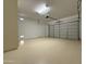 Spacious garage featuring epoxy flooring and a bright overhead light at 3780 E Rakestraw Ln, Gilbert, AZ 85298