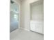 Bright hallway features tile flooring and built-in storage, leading to another room at 3780 E Rakestraw Ln, Gilbert, AZ 85298