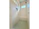 Modern tiled shower with built-in seat, shower niche, and glass block window at 3780 E Rakestraw Ln, Gilbert, AZ 85298