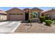 Charming single-story home featuring a low-maintenance desert landscape and a welcoming front entry at 44837 W Horse Mesa Rd, Maricopa, AZ 85139