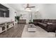 Inviting living room with hardwood floors, comfortable seating, and lots of natural light at 44837 W Horse Mesa Rd, Maricopa, AZ 85139