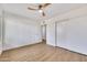 Spacious bedroom with a ceiling fan, closet, and natural light at 5008 W New World Dr, Glendale, AZ 85302