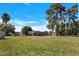 View of well maintained, modern single-story homes with mature shade trees and green lawns at 5008 W New World Dr, Glendale, AZ 85302