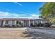 Charming single-story home featuring a well-manicured front yard and neutral exterior paint at 5008 W New World Dr, Glendale, AZ 85302