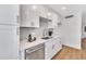 Detailed shot of the kitchen showcasing stainless steel appliances and sleek white countertops at 5008 W New World Dr, Glendale, AZ 85302