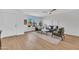 Inviting living room with ample natural light, modern furnishings, and wood-look flooring at 5008 W New World Dr, Glendale, AZ 85302