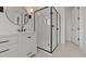 Bathroom showcases a sleek, modern shower with black trim and glass enclosure next to vanity at 537 E Aurora Dr, San Tan Valley, AZ 85140