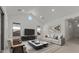 Vaulted ceilings and a large picture window add to the charm of this contemporary living room at 537 E Aurora Dr, San Tan Valley, AZ 85140