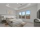 The main bedroom features a decorative trey ceiling, plush carpet, and large windows at 537 E Aurora Dr, San Tan Valley, AZ 85140