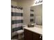 Clean bathroom featuring a shower/tub combo, a white vanity with storage, and a neutral color scheme at 6191 S Pearl Dr, Chandler, AZ 85249